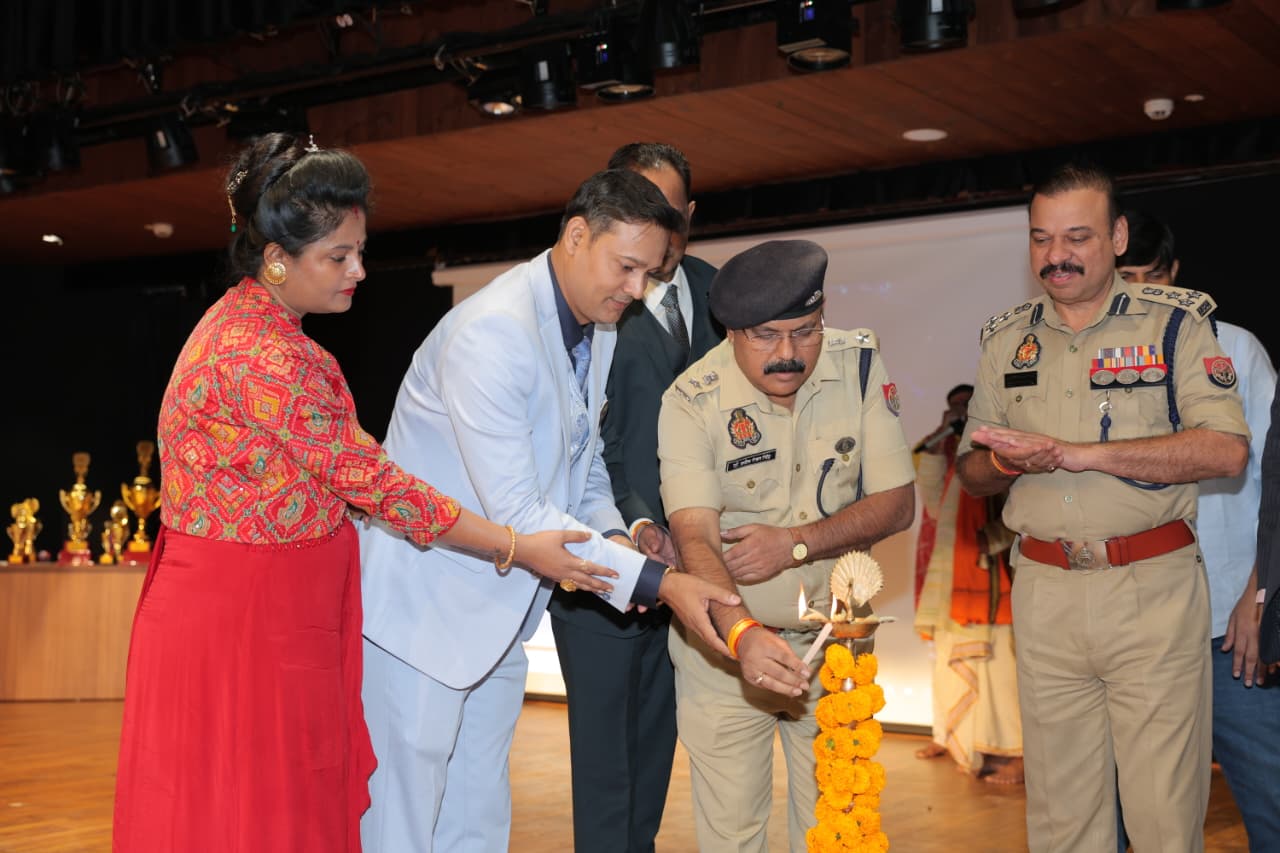 Guests and senior police officers lighting the ceremonial lamp on stage